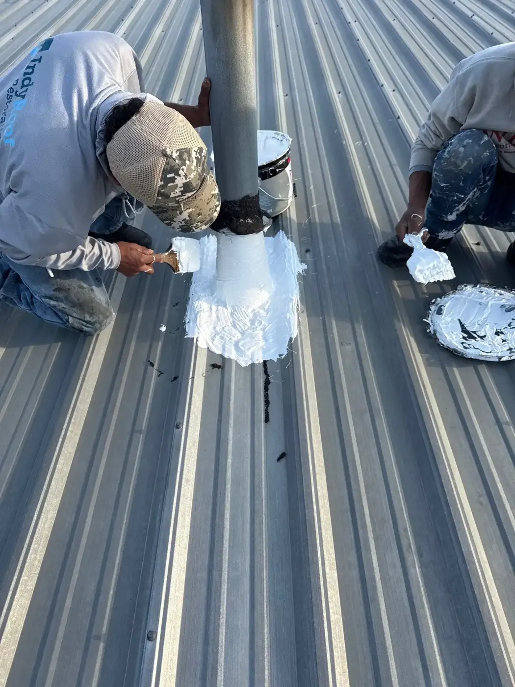 Tarping and dry-in on a Featherstone commercial roof